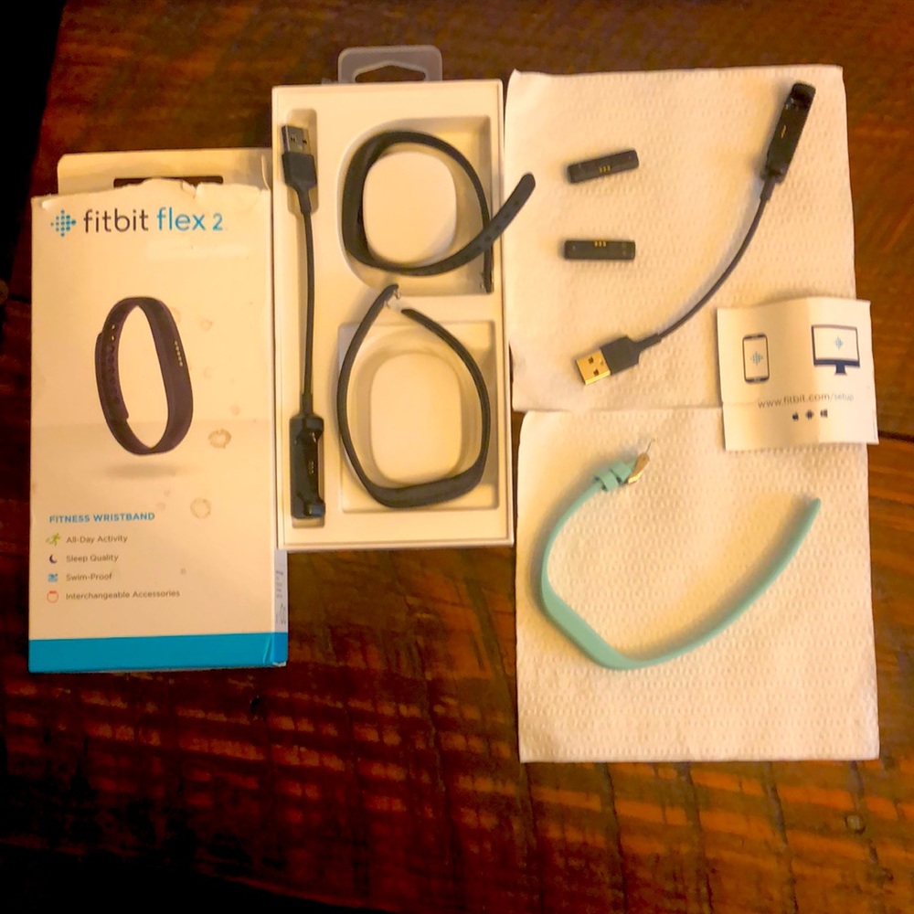 Price includes 2 fitbits—-3 bracelets-2 chargers